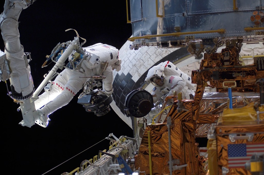 Hubble turns at about the speed of a minute hand on a clock by using four reaction wheels. It takes Hubble about 14 minutes to turn 90 degrees.