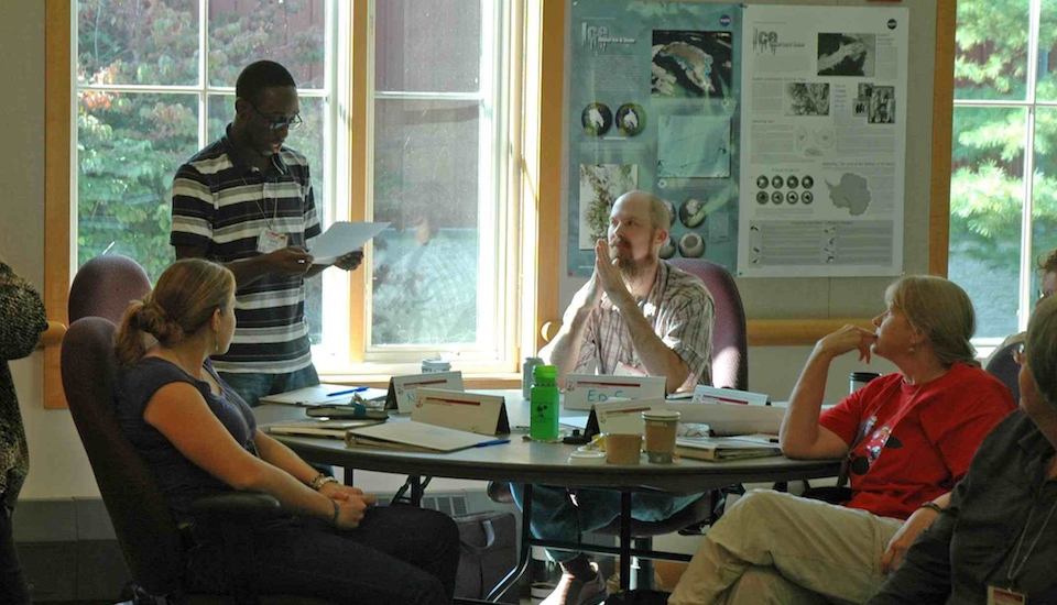 Earth to Sky group sitting at table